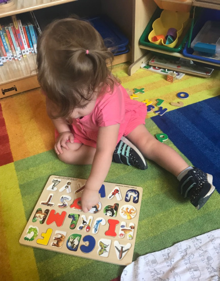 ABA Therapy - Toddler completing a puzzle